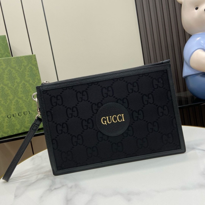 G*u*i clutch bags